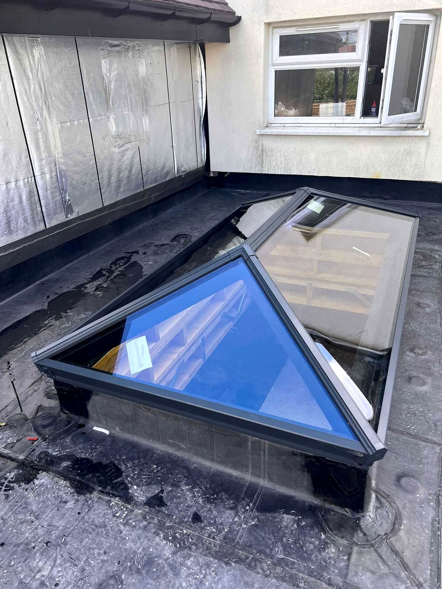 Modern roof lantern skylight installation by CJB Renovations